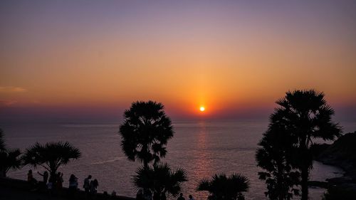 Scenic view of sea against romantic sky at sunset