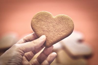 Hand holding a heart cookie