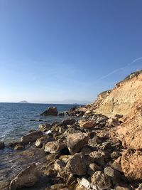 Scenic view of sea against clear blue sky