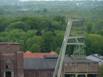 High angle view of building and trees in forest