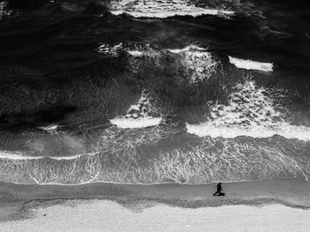 Silhouette man walking on beach