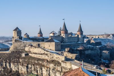 Panoramic view of the kamianets-podilskyi fortress on a sunny winter morning