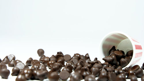 Close-up of coffee beans against white background