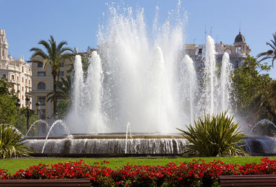 Scenic view of waterfall against sky