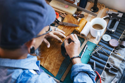 High angle view of man working on table