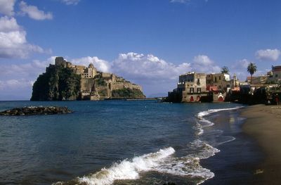 View of sea with buildings in background