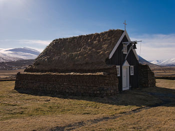 House on field against sky