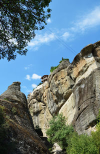 Low angle view of rock formations against sky