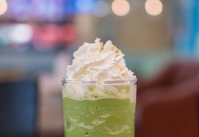 Close-up of ice cream in glass on table