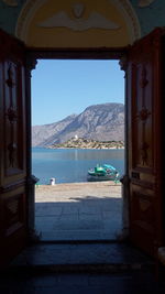 View of sea seen through window