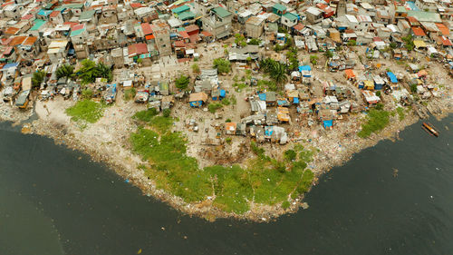 Poor district and slums in manila with shacks and buildings. manila, philippines.