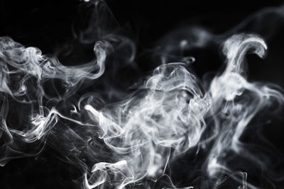 Close-up of smoke against black background