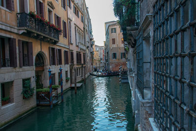 Canal amidst buildings in city