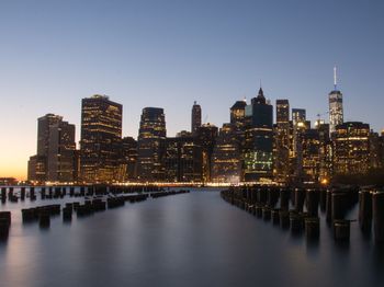 Illuminated city at waterfront