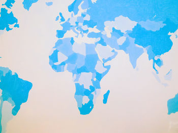 Close-up of blue over white background