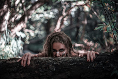 Portrait of woman in forest