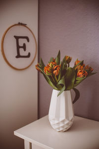 Close-up of vase on table at home