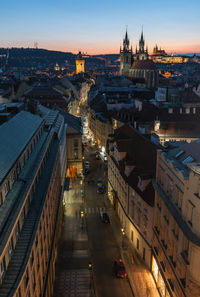 High angle view of illuminated street amidst buildings in city