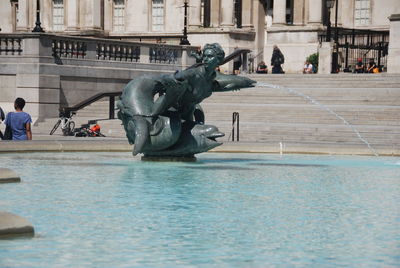 Statue in front of building