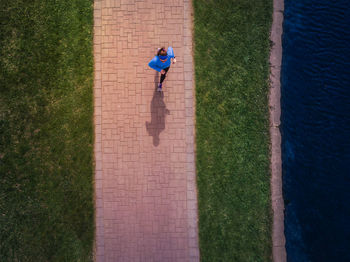 High angle view of woman jogging at park