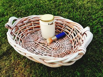 High angle view of wicker basket on field