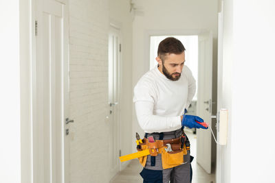 Side view of man working in workshop