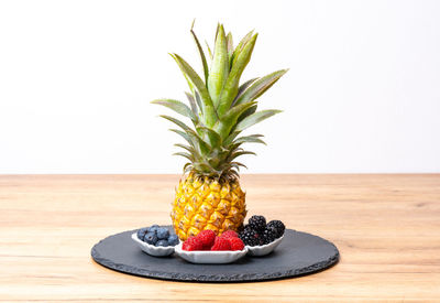 Close-up of pineapple against white background