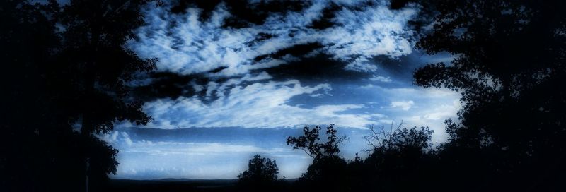 Scenic view of landscape against cloudy sky