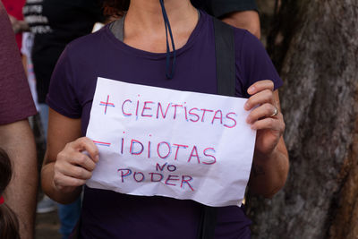 People are seen protesting against the cuts in education funding by president jair bolsonaro 