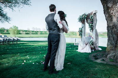 Couple standing on field