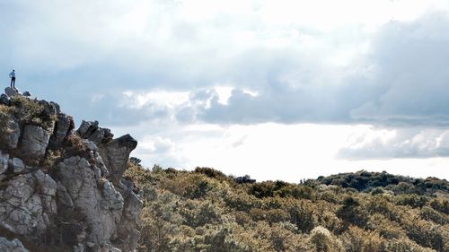 Low angle view of rock formation against sky