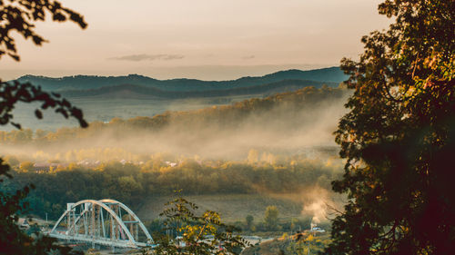 Scenic view of bridge against sky during sunset