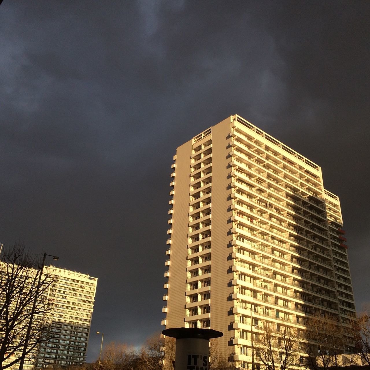 building exterior, architecture, built structure, low angle view, city, sky, modern, skyscraper, tall - high, office building, cloud - sky, tower, building, cloudy, outdoors, residential building, cloud, no people, city life, tall