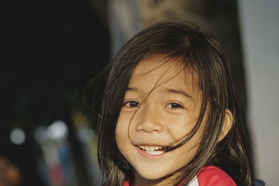 Close-up portrait of smiling girl