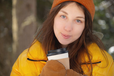 Portrait of beautiful woman reusable cup