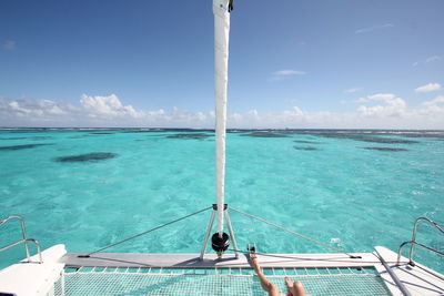 Scenic view of swimming pool by sea against sky