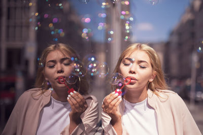 Portrait of a beautiful young woman at bubbles