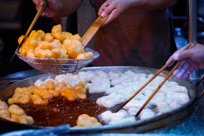 Close-up of person preparing food