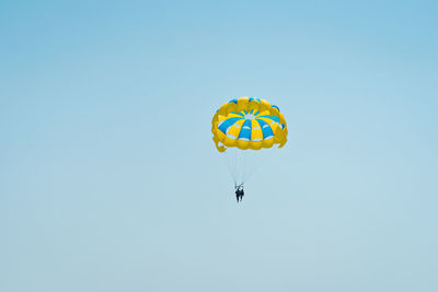 Low angle view of kite flying against clear sky