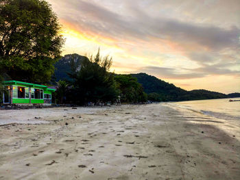 Scenic view of beach against sky during sunset