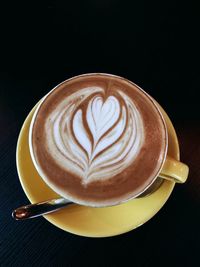 High angle view of cappuccino on table