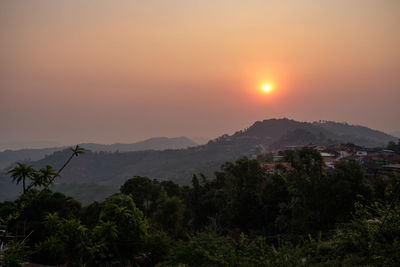 Scenic view of mountains against sky during sunset