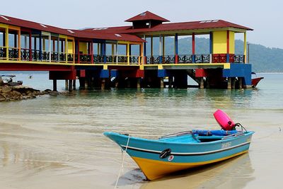 Boat moored in water