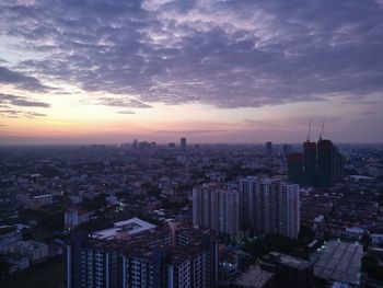 High angle view of buildings against sky at sunset