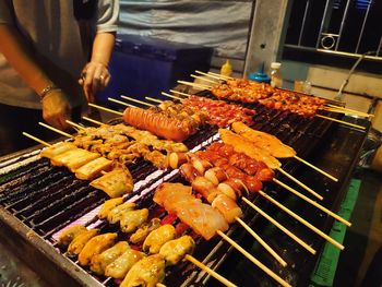 High angle view of meat on barbecue grill