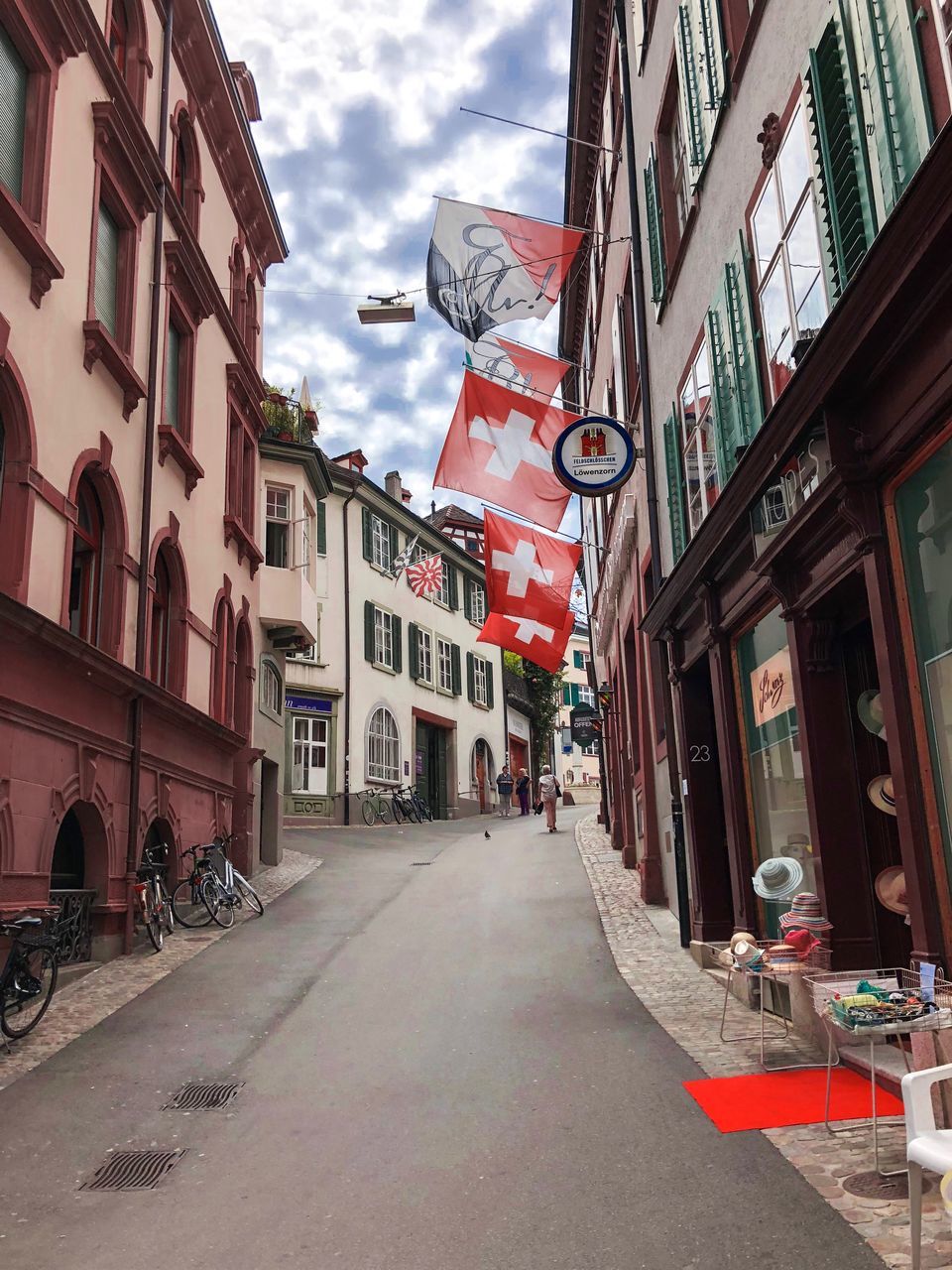 STREET AMIDST BUILDINGS AGAINST SKY