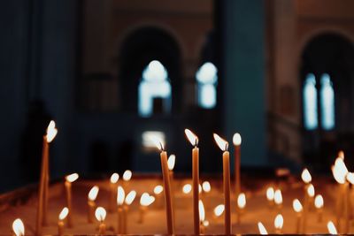 Lit candles in temple