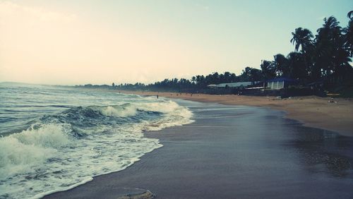 Scenic view of beach against clear sky