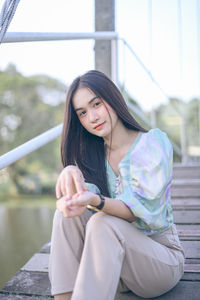 Young woman sitting outdoors