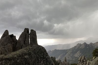 Scenic view of mountain against cloudy sky